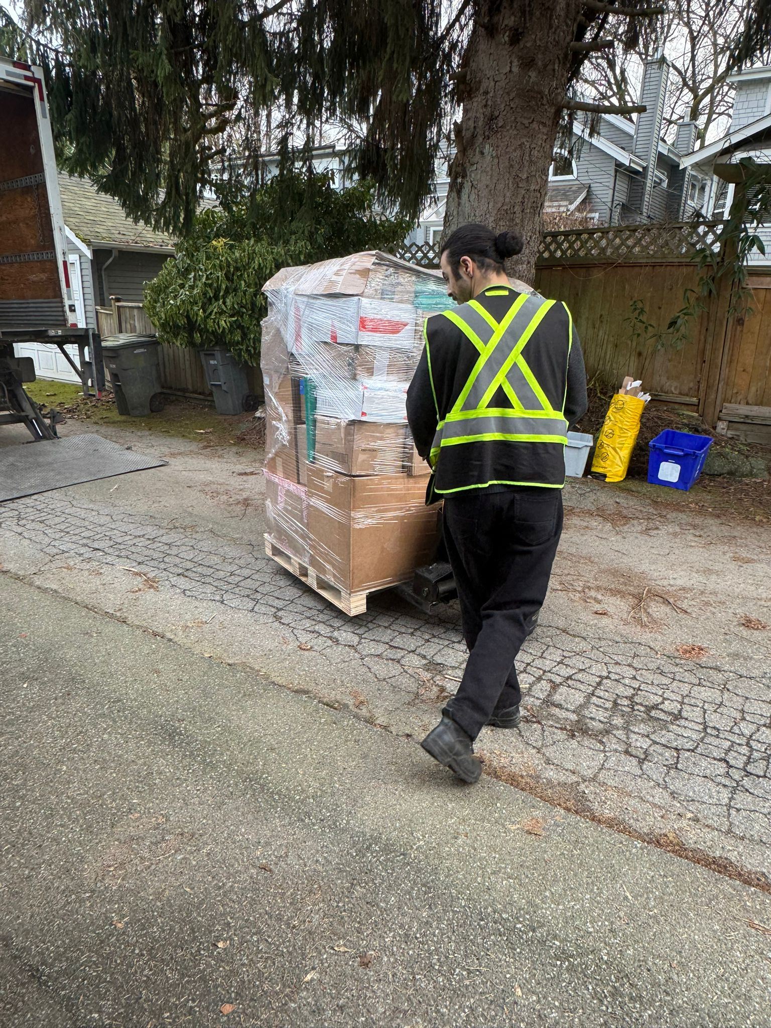 Heading into 2026 Batch - Worker using pallet jack to transport wrapped pallet