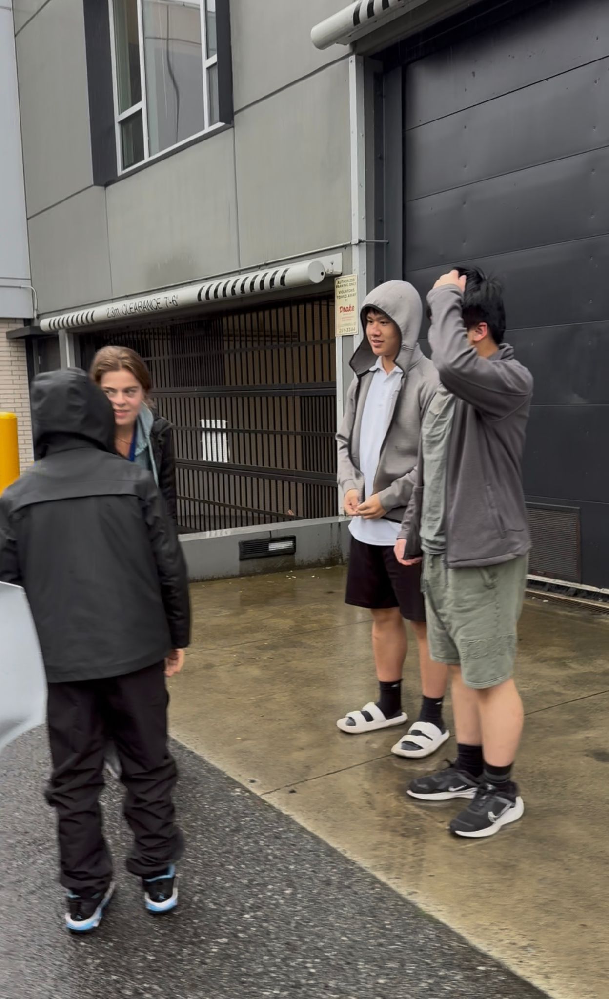 Thanksgiving Donation - Team members arriving at BCIHS in rainy weather