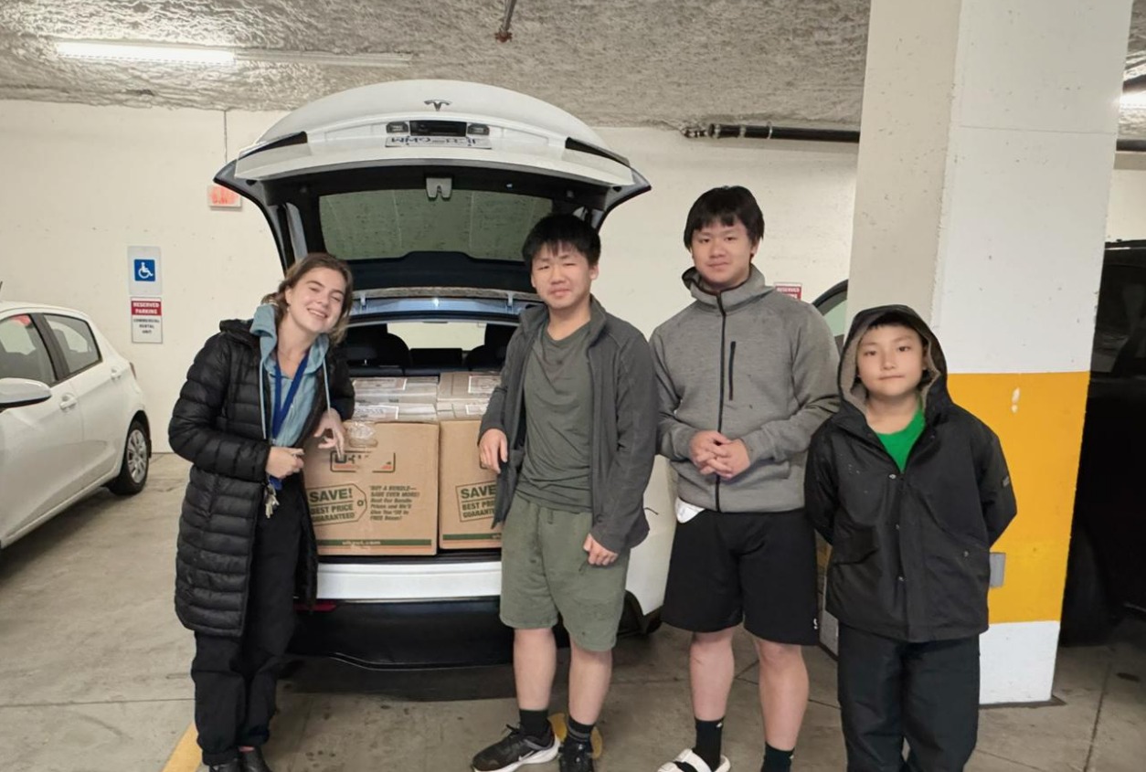 Thanksgiving Donation - R3 team photo in underground parking with loaded vehicle