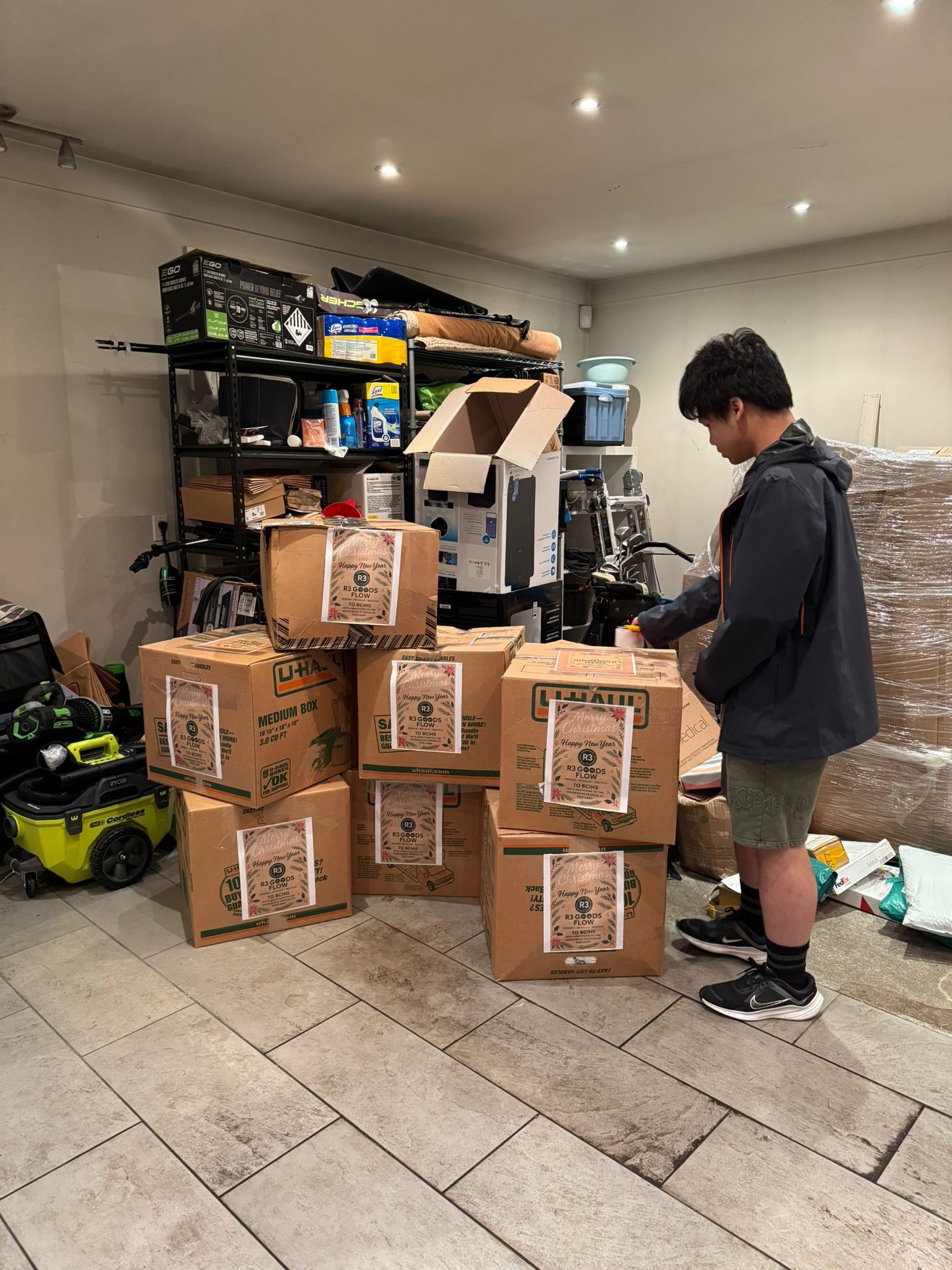 Approaching Christmas 2025 - Volunteer preparing donation boxes